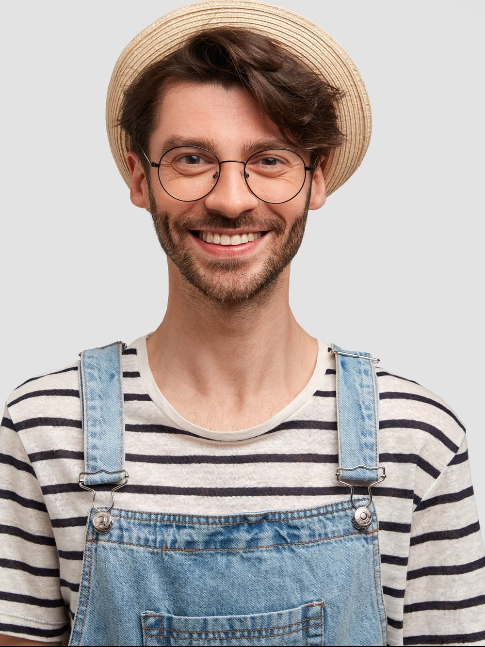 studio shot of good looking bearded male gardener in casual srtiped sweater denim overalls and stra e1619344128801.jpg
